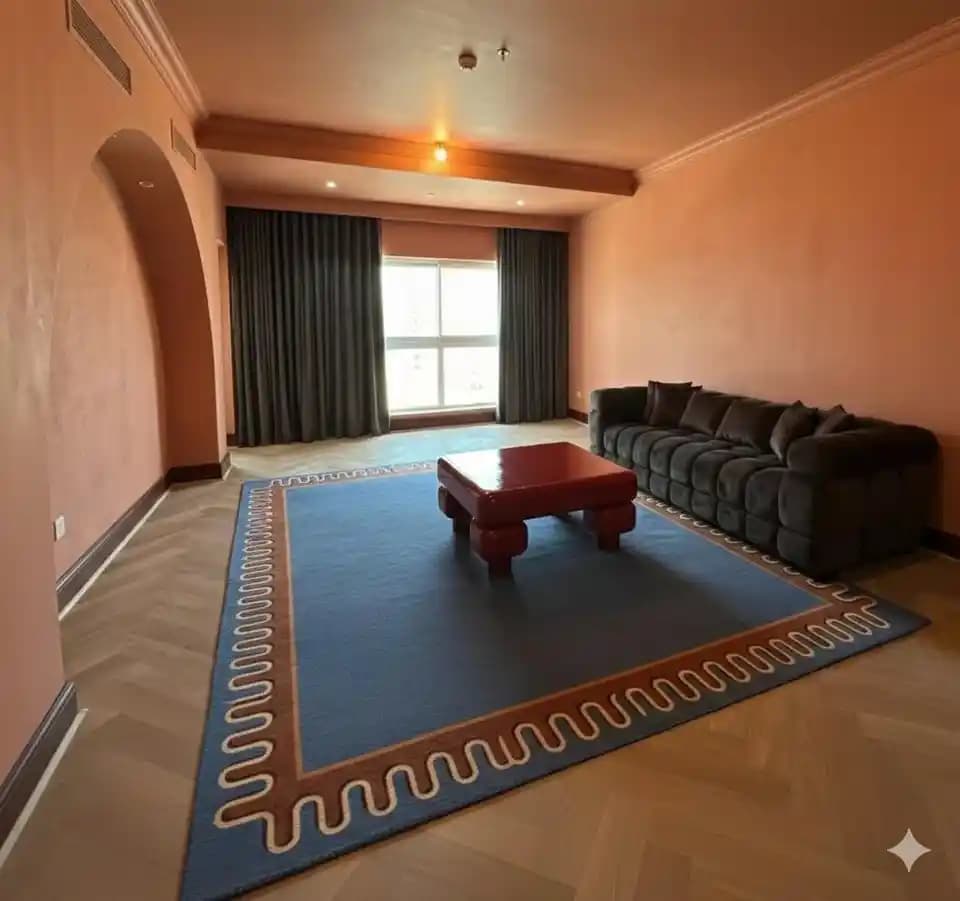 Turuncu Duvarlı Oturma Odalarında Mavi Tonlarında Halı Seçimi ve Dekorasyon Uyumu